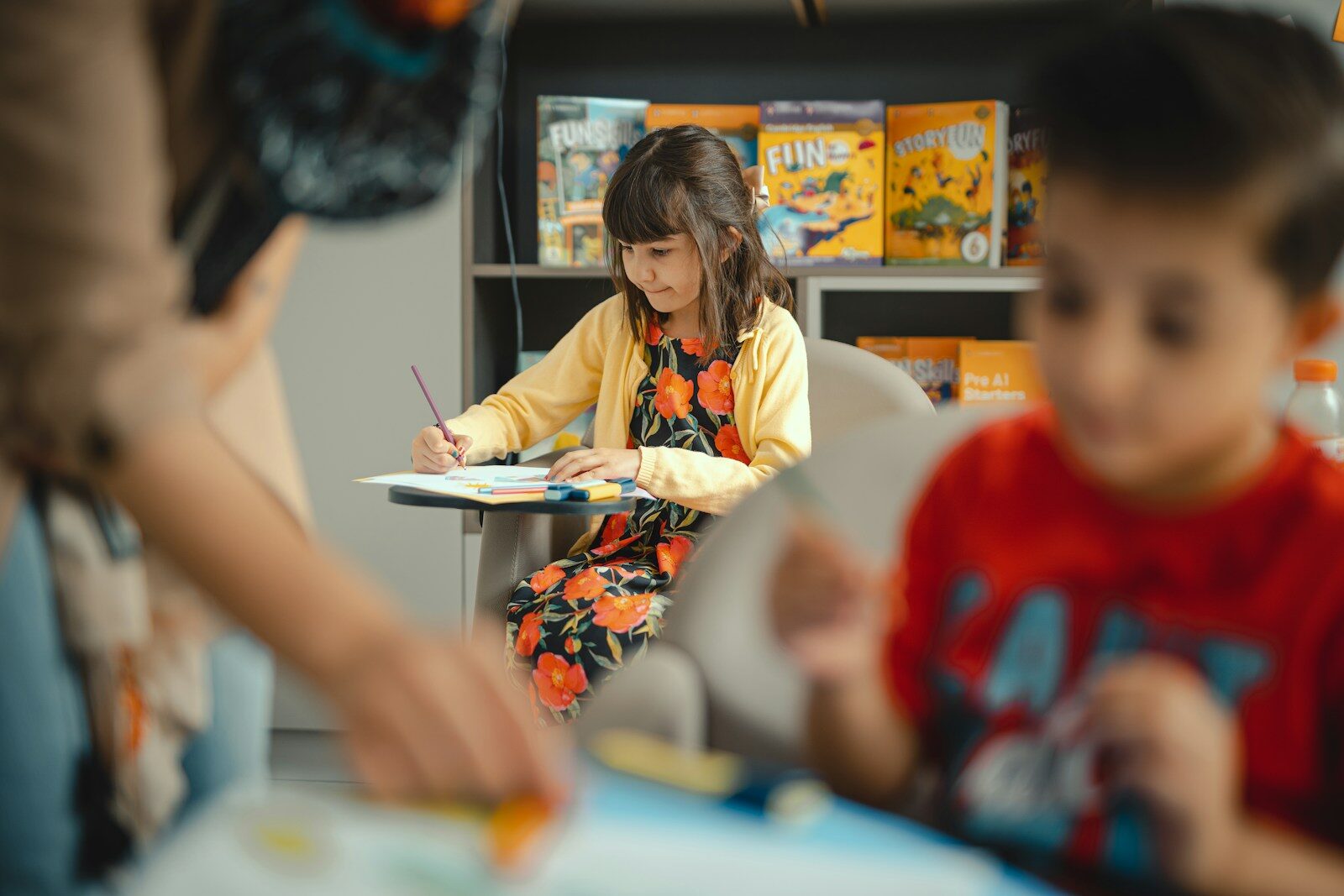 Children learning and creating art in a classroom.